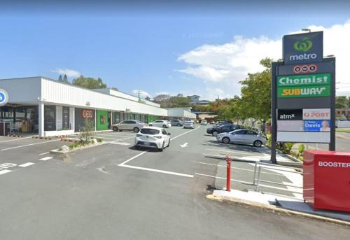 a street with cars parked in a parking lot at Entire House near Brisbane City 2Beds in Brisbane