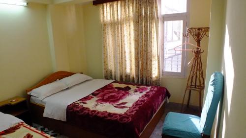 Postel nebo postele na pokoji v ubytování Hotel Dolphin