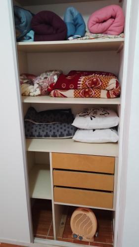 a closet filled with lots of pillows and towels at Aires del Cerro in Yerba Buena