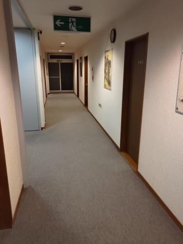 an empty hallway in an office building at Sunshine Kyohei in Nozawa Onsen