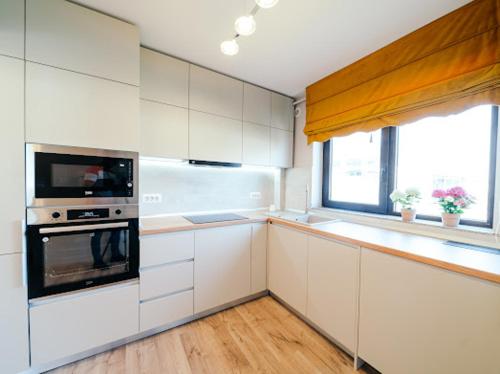 Kuchyň nebo kuchyňský kout v ubytování RAINFOREST APARTAMENT