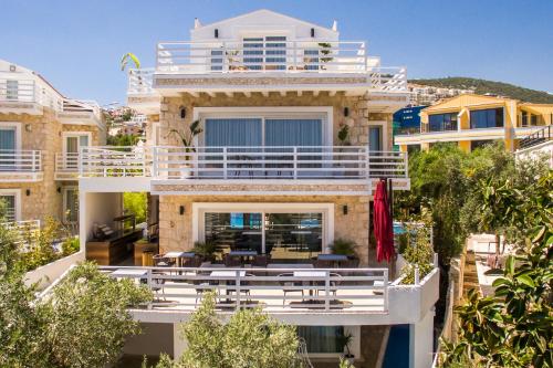 a villa with a view of a building at Kalkan Saray Suites Hotel in Kalkan