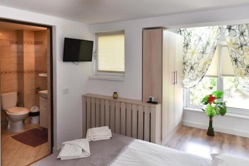 Säng eller sängar i ett rum på Aparthotel Metropol