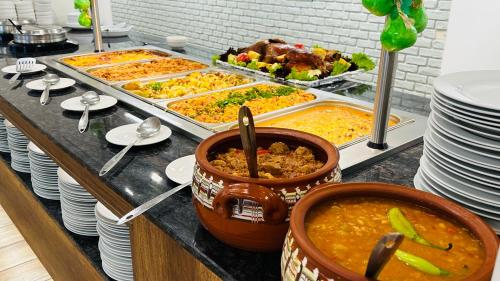 a buffet line with many different types of food at Queen Nelly Park in Kiten