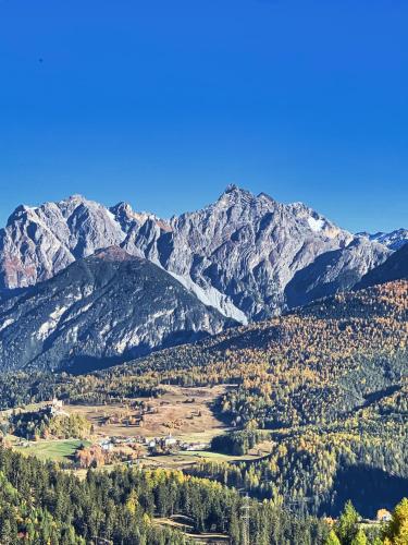 a view of a valley with mountains in the background at Ein Kraftort und architektonisches Juwel in Ardez