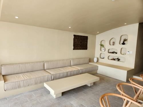 a living room with a couch and a table at Banwol Poolvilla in Busan