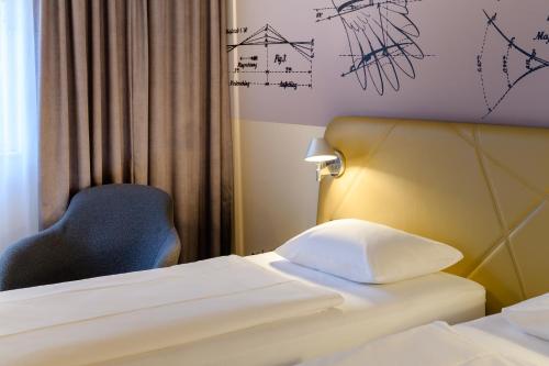 Una cama o camas en una habitación de Mercure Hotel Berlin City