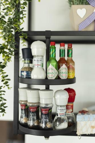 a shelf filled with bottles of condiments at D8 B&B in Zadar