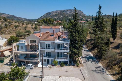 an aerial view of a large white house at Bourtzi View Villa in Nafplio