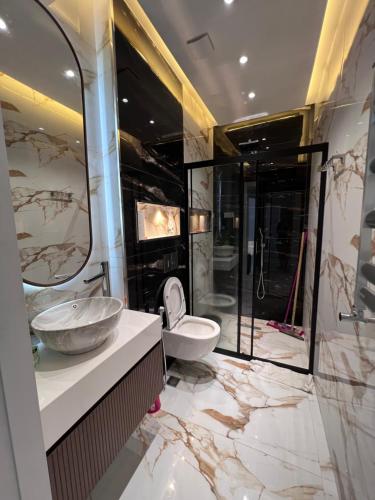 a bathroom with a sink and a toilet at Villa boho in Baku