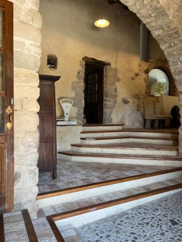 an entrance to a building with stairs and a door at Can Maimes in Agullana