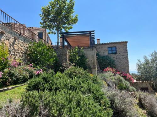 a view of a house with a garden at Can Maimes in Agullana