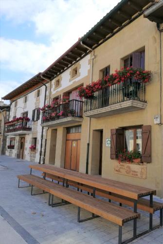 a row of benches in front of a building at Casa Rural Reparaz in Arbizu