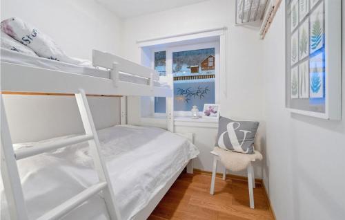 a bedroom with a bunk bed and a chair at Lovely Apartment In Geilo With Wifi in Geilo