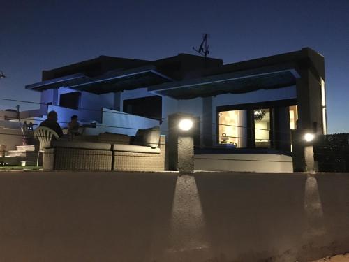 a house with lights in front of it at night at The Diamond of Kriaritsi "Villas with private pools & hydromassage" in Kriaritsi