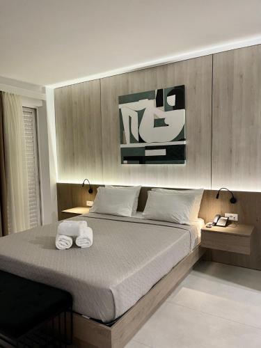 Ένα ή περισσότερα κρεβάτια σε δωμάτιο στο Galaxy Hotel