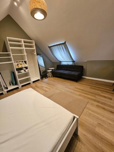 a living room with a bed and a couch at Best Prater Apartments in Vienna