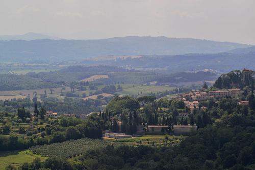 a view of a town in a valley with trees at La Casina di Sarteano in Sarteano