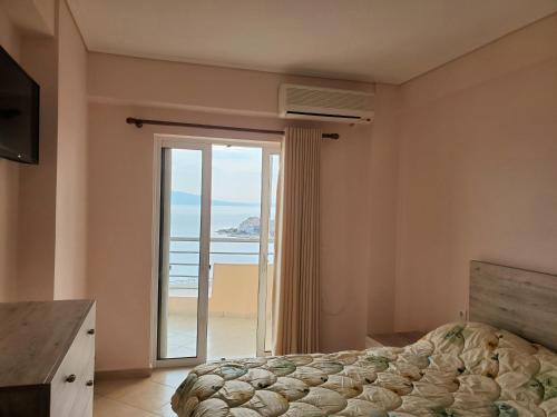 A bed or beds in a room at Saranda View