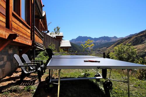 a ping pong table in front of a house at Prestigious 18 Person Chalet with Pool and Jacuzzi in Vars
