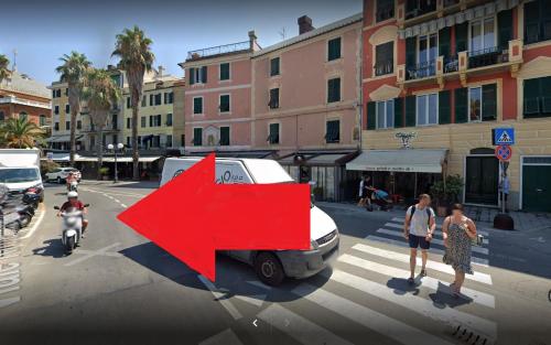 a white van with a red arrow on the street at Sestri DeLuxe Penthouse All Included in Sestri Levante