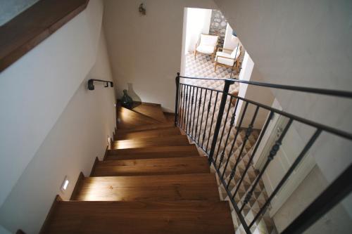 a staircase in a house with wooden floors at Casa Marinari in Scalea