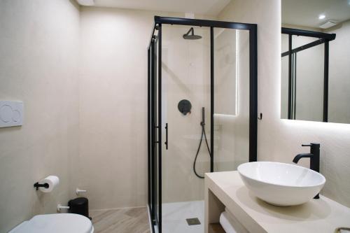 a bathroom with a sink and a shower at Casa Marinari in Scalea