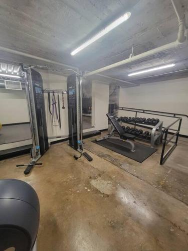 an empty room with a gym with a treadmill at Silo View - heart of downtown in Waco
