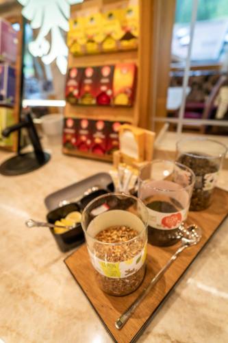 a cutting board with bowls of food on a counter at Hotel Neuhintertux 4 Sterne superior in Tux