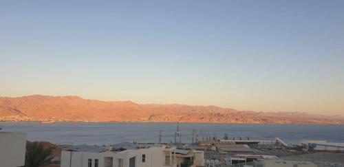 a view of a large body of water with buildings at Bay VIew in Eilat