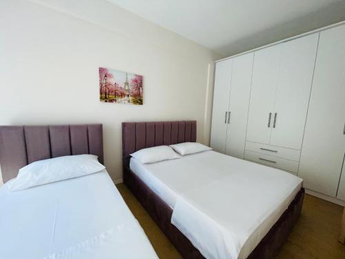 Postelja oz. postelje v sobi nastanitve New Apartment in Center of Tirana