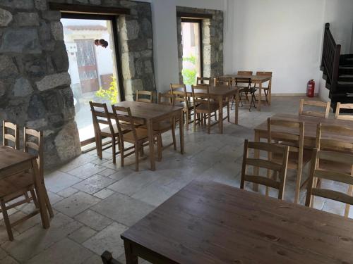 a dining room with wooden tables and chairs at AGON Ephesus in Selcuk