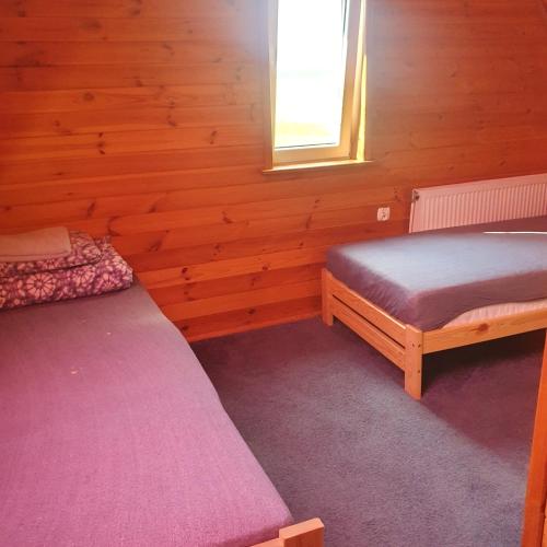 Cama o camas de una habitación en Domek Pod Akacjami