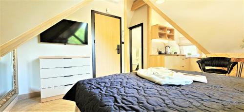 Cama o camas de una habitación en VIP APARTAMENTY Chałubińskiego APART