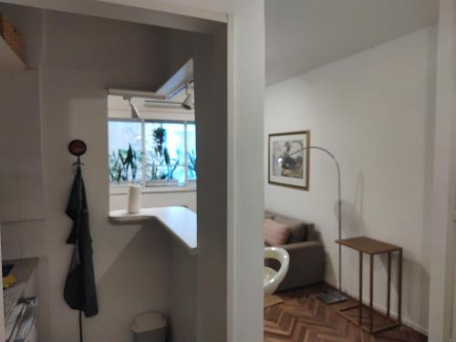 a living room with a sink and a mirror at Luminoso Estudio en Palermo! II in Buenos Aires