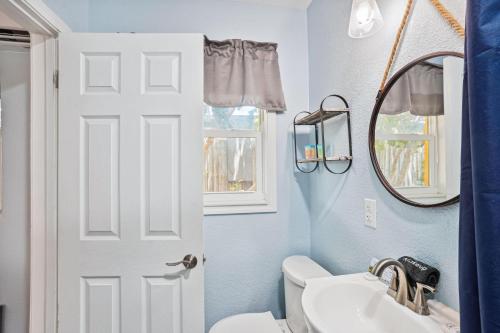 a bathroom with a white toilet and a sink at Upham Beach Inn - #3 Studio in St. Pete Beach