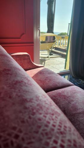 a row of red seats on a train at Hotel Zia Piera in Chiavari