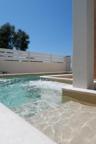 a pool of water in the middle of a building at Calypso Luxury Pool&Spa in Pula