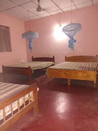 Voodi või voodid majutusasutuse Kataragama holiday Home s Rooms Rentall toas