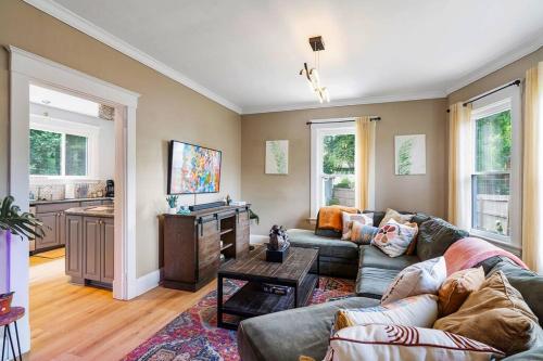 a living room with a couch and a table at Modern Oakley Retreat - King Bed - Free Parking - Centrally Located in Cincinnati
