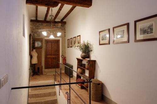 a hallway with a staircase in a house at Casa bascara in Báscara