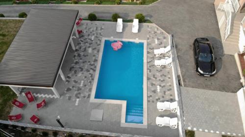 an overhead view of a swimming pool with a car at Vila Sanela in Sarajevo