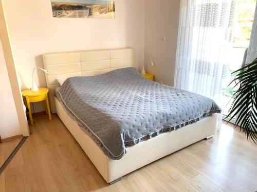 Postel nebo postele na pokoji v ubytování Apartament Nadmorski