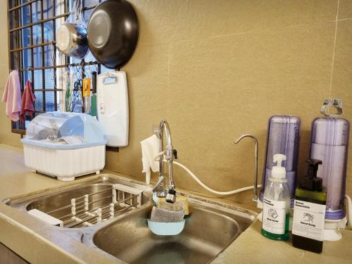 a kitchen counter with a sink with a sink at USJ Subang Jaya Sunway Paradise Home Staycation-PH1346 in Subang Jaya