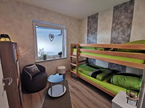 Postel nebo postele na pokoji v ubytování Ferienwohnung am Dock