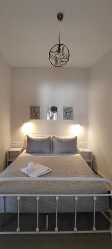 a bedroom with a bed with a book on it at Serene, slow living house in Orné