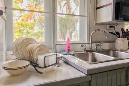 a kitchen counter with a sink and a window at Casa Isabel in Rincon