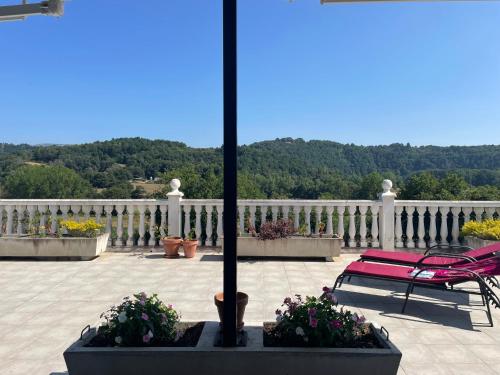 a red bench on a porch with a white fence at Casa Acougo, Sarria in Sarria