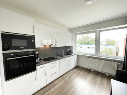 Dapur atau dapur kecil di Zentrale Wohnung mit 3 Schlafzimmer für bis zu 9 Personen
