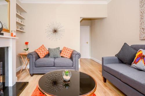 a living room with two couches and a coffee table at New - Prospect lodge , City Centre Terraced House in York